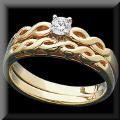 Raymond Jewelers : Links of gold make up this lovely contemporary bridal set design. We use a quality diamond which is the center piece of this two piece set. Click here for all the details! Reg. Price $599 Sale $425