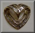 Raymond Jewelers :  to our Specials!Stunning 14K yellow gold heart shape pendant slide is channel set with quality baguettes and round diamonds.  Total diamond weight of this terrific piece is 1.30 carats! This slide will fit a 6mm or smaller omega style chain.  Details Here. One left!  Reg. Price $1,595.00 Closeout Sale Price $1,325.00